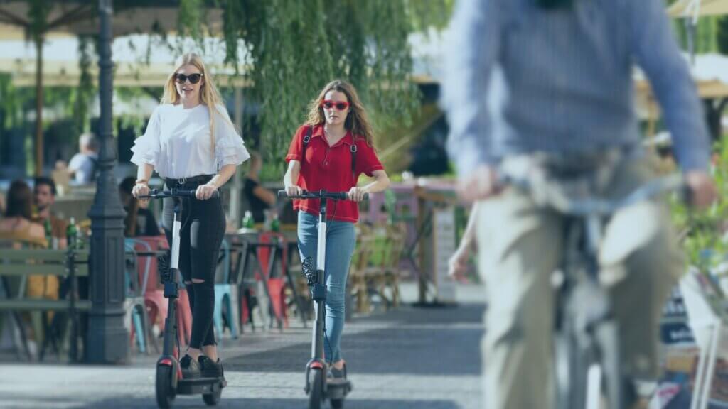 two women in the distance on electric scooters