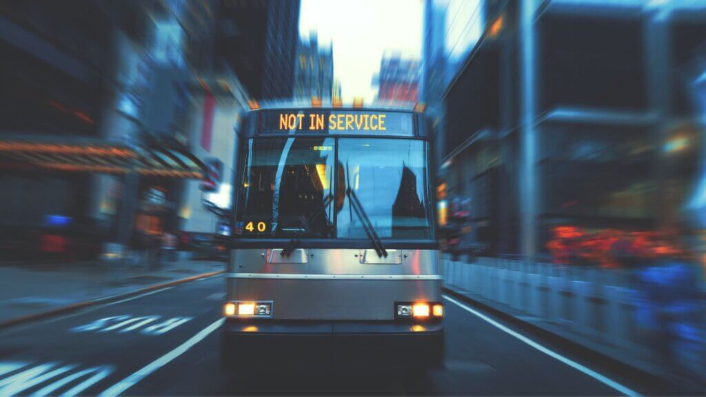 An out of service bus travelling down a Toronto street.