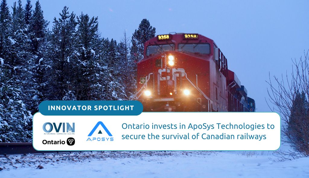 A freight train is passing through Banff National Park, stirring rocks and snow as it passes.